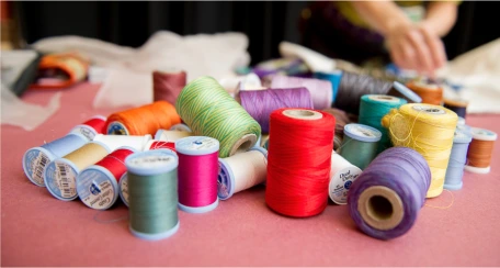 Several spools of colorful thread